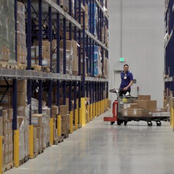 An employee operates machinery at Baylor Scott and White Logistics in Temple, TX