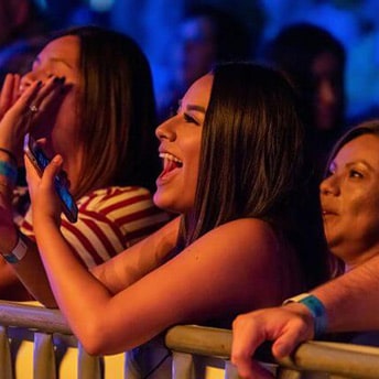 Three woman cheering